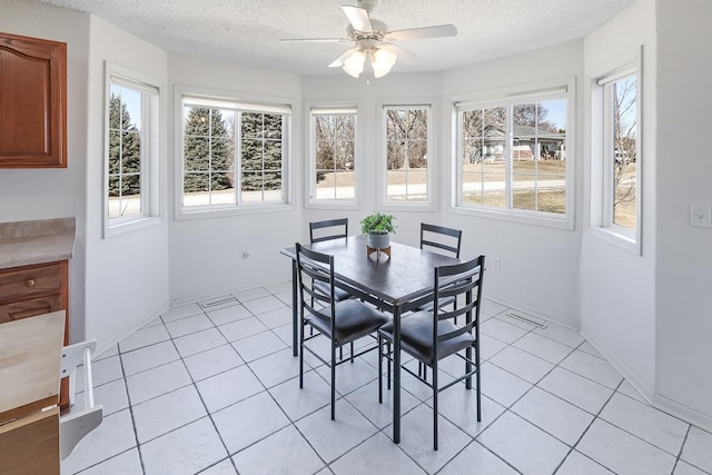 sunroom / solarium featuring a ceiling fan and visible vents