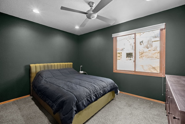 carpeted bedroom featuring recessed lighting, visible vents, baseboards, and a ceiling fan