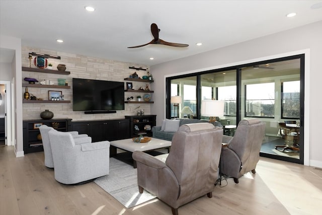 living area featuring recessed lighting, light wood-style floors, and ceiling fan