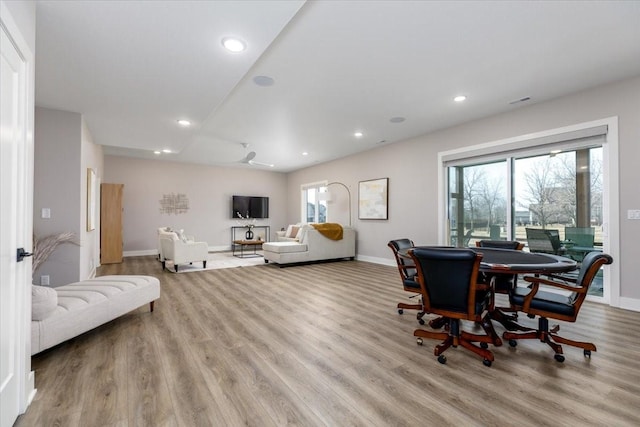 dining space featuring recessed lighting, plenty of natural light, and wood finished floors