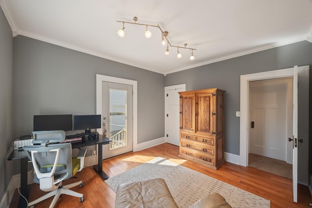 home office with hardwood / wood-style floors and ornamental molding