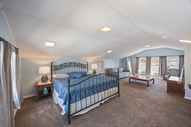 carpeted bedroom featuring baseboards and lofted ceiling