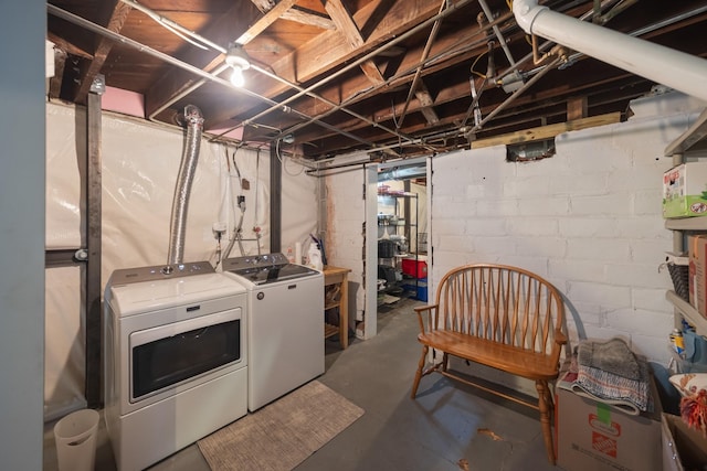 unfinished basement featuring separate washer and dryer