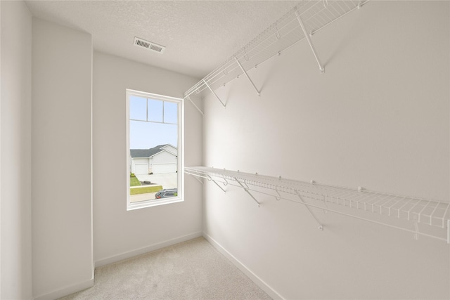 1506 E Girard Ave, Indianola, IA 50125 - walk in closet featuring carpet floors