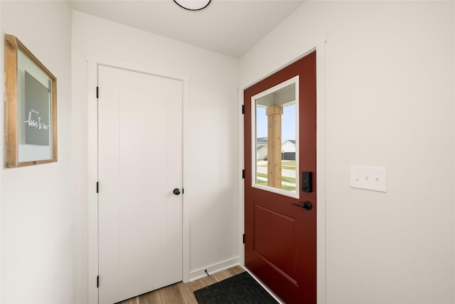 1506 E Girard Ave, Indianola, IA 50125 - doorway to outside featuring light wood finished floors