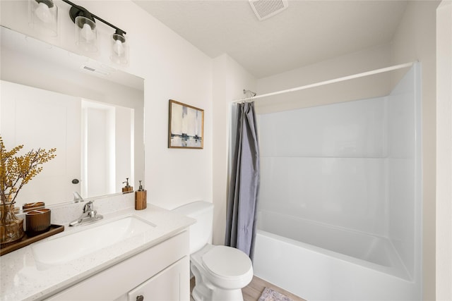 1506 E Girard Ave, Indianola, IA 50125 - full bath featuring vanity, toilet, and shower / bath combo