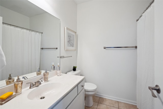 full bath with vanity, tile patterned floors, toilet, and baseboards