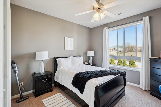 bedroom featuring baseboards, carpet, and a ceiling fan