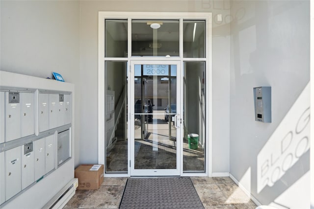 view of exterior entry with stucco siding