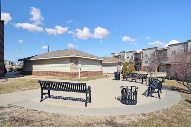 view of property's community with a patio area