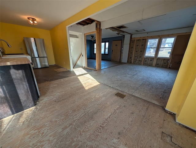 interior space featuring plenty of natural light, visible vents, and a sink