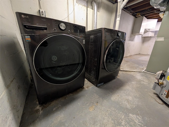 clothes washing area with laundry area and washer and dryer