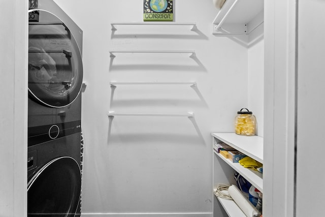 interior space featuring laundry area and stacked washer / drying machine