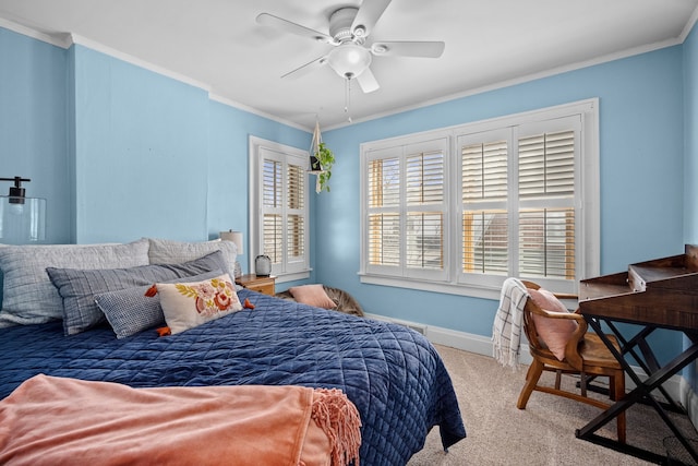 bedroom with ceiling fan, baseboards, carpet floors, and ornamental molding