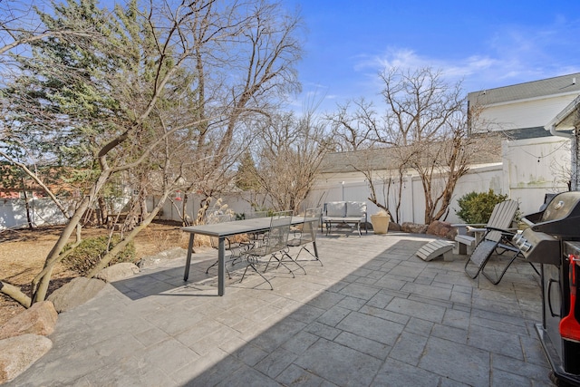 view of patio / terrace with outdoor dining area and a fenced backyard