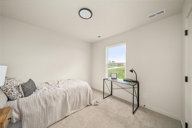 1502 E Girard Ave, Indianola, IA 50125 - carpeted bedroom featuring baseboards