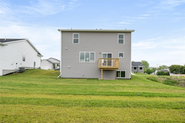 1502 E Girard Ave, Indianola, IA 50125 - rear view of house with a yard, central air condition unit, and a balcony