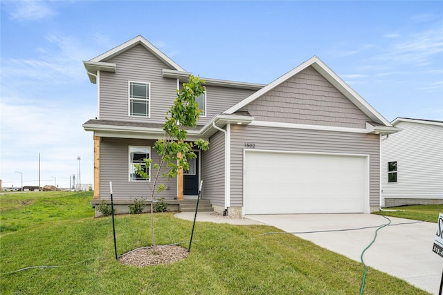 1502 E Girard Ave, Indianola, IA 50125 - view of front of house with concrete driveway, a front yard, and an attached garage