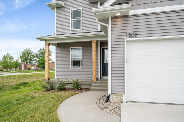 1502 E Girard Ave, Indianola, IA 50125 - property entrance with covered porch and a lawn
