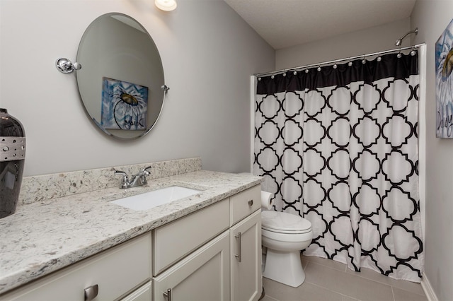 bathroom with curtained shower, toilet, vanity, and tile patterned flooring