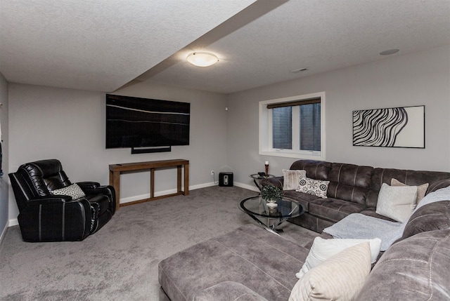 carpeted living room with visible vents, a textured ceiling, and baseboards