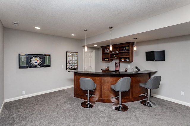 bar with dark colored carpet, baseboards, and indoor bar