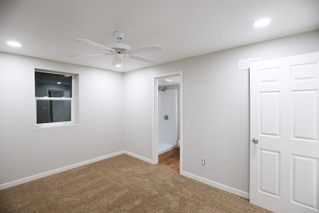 unfurnished bedroom with recessed lighting, visible vents, carpet floors, and baseboards