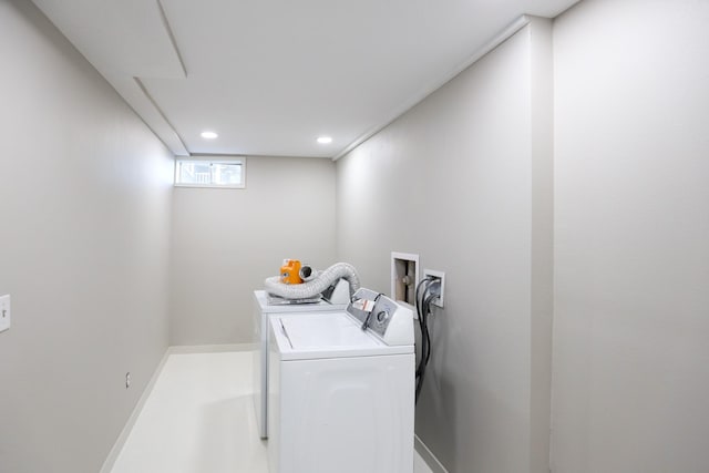 washroom featuring laundry area, recessed lighting, separate washer and dryer, and baseboards