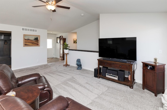 living room featuring visible vents, baseboards, vaulted ceiling, carpet flooring, and a ceiling fan