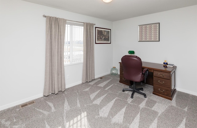 office area featuring visible vents, baseboards, and carpet