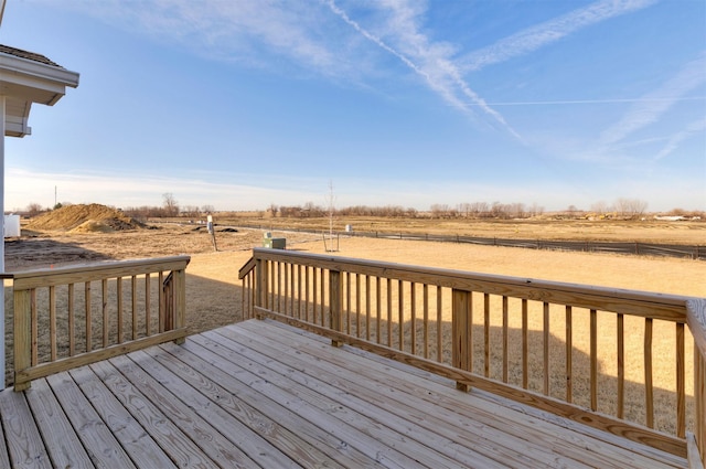 wooden deck with a rural view