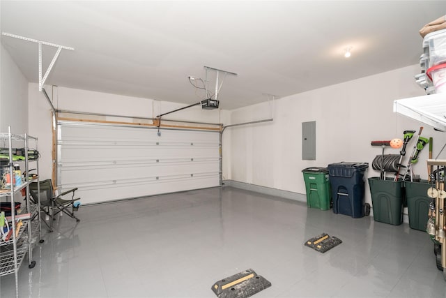 garage featuring electric panel and a garage door opener