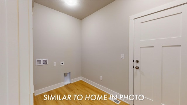 clothes washing area with washer hookup, light wood finished floors, baseboards, hookup for an electric dryer, and laundry area