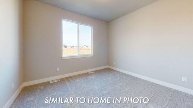 unfurnished room featuring visible vents, baseboards, and carpet