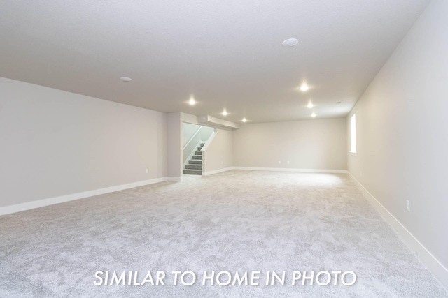 10022 NW 68th Ave, Johnston, IA 50131 - basement with stairway, carpet flooring, baseboards, and recessed lighting