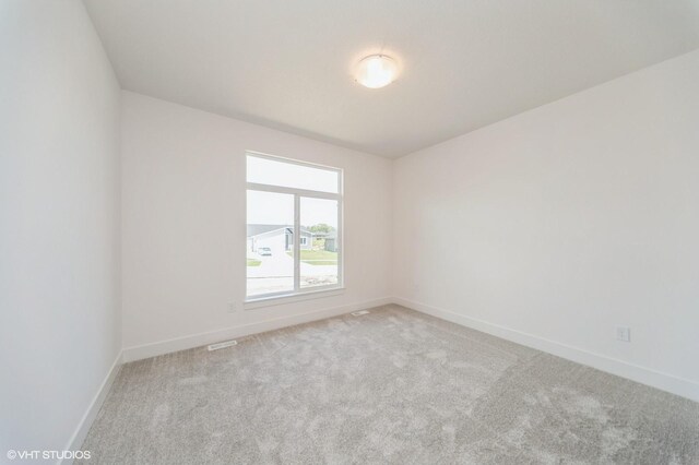 10022 NW 68th Ave, Johnston, IA 50131 - spare room with carpet flooring and baseboards