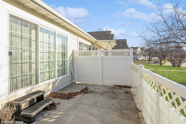 view of patio featuring fence