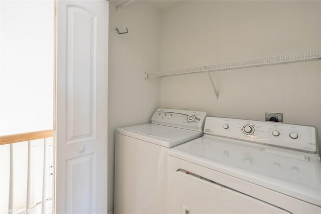 washroom with laundry area and washing machine and dryer