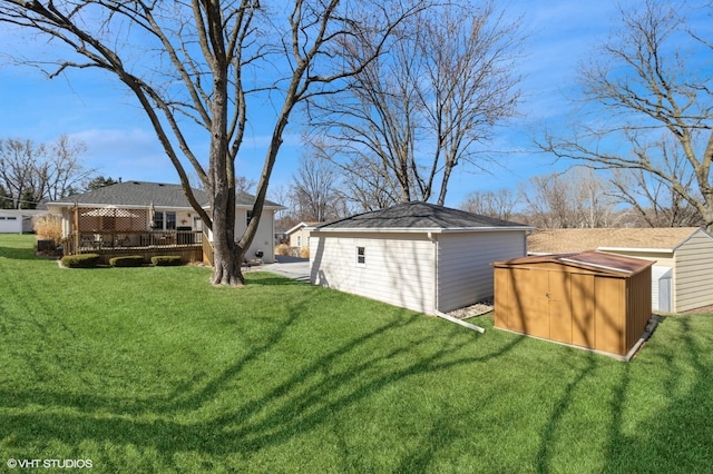 view of yard featuring a storage shed and an outdoor structure