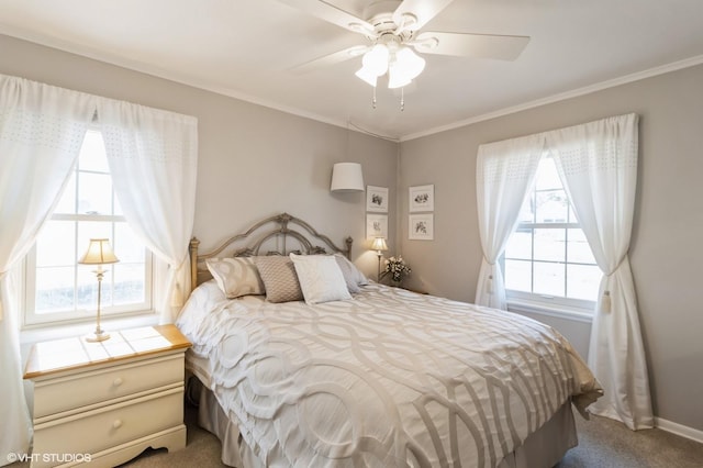 bedroom featuring ceiling fan, baseboards, ornamental molding, and carpet flooring