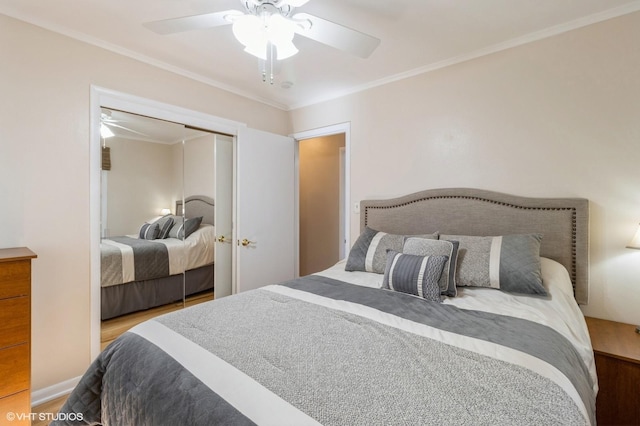 bedroom with crown molding, wood finished floors, a closet, and ceiling fan