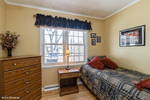 bedroom featuring light wood-style flooring, crown molding, baseboards, and a baseboard radiator