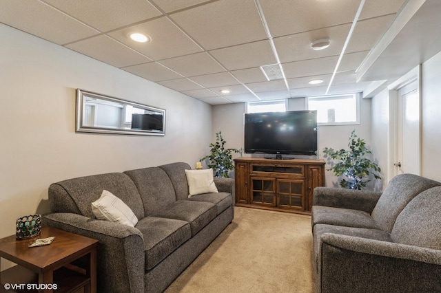 living room with recessed lighting, a paneled ceiling, and light colored carpet