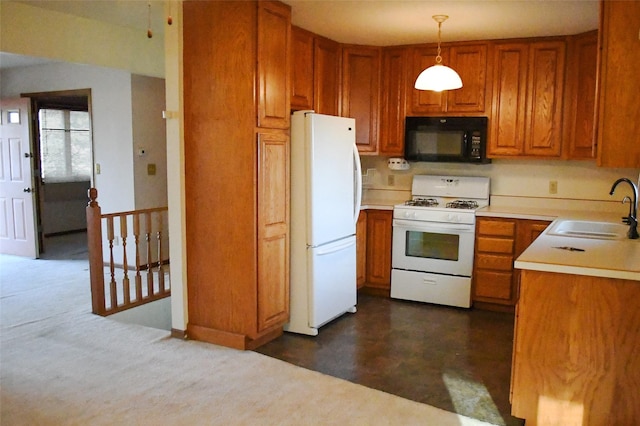 kitchen with white appliances, light countertops, brown cabinets, and a sink