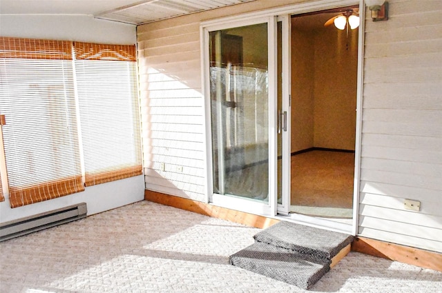 unfurnished sunroom with a baseboard radiator