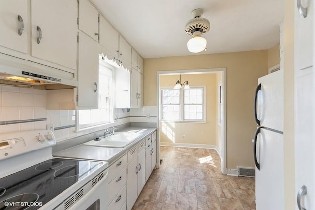 kitchen with white appliances, a sink, decorative backsplash, light countertops, and under cabinet range hood