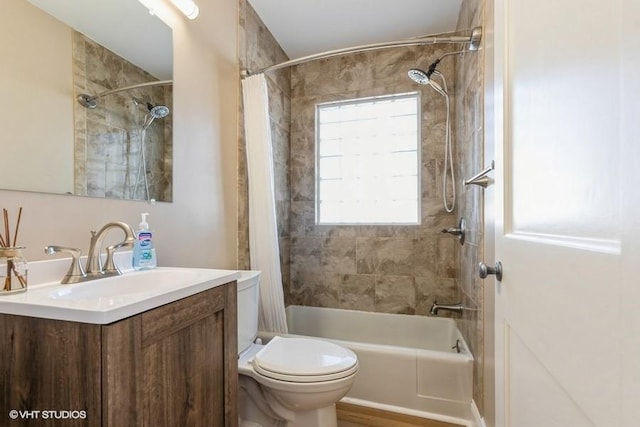 full bath with vanity, shower / tub combo, and toilet