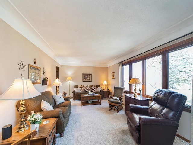 carpeted living room with ornamental molding