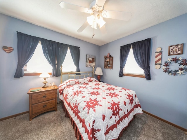 bedroom featuring ceiling fan, baseboards, and carpet floors