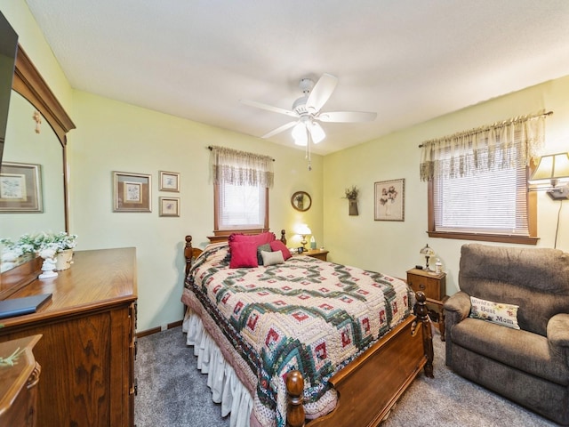 carpeted bedroom featuring baseboards and ceiling fan